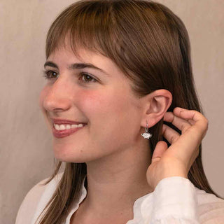 Women wearing sterling silver gingko earrings