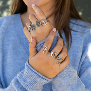 Model wearing sterling silver adjustable rings
