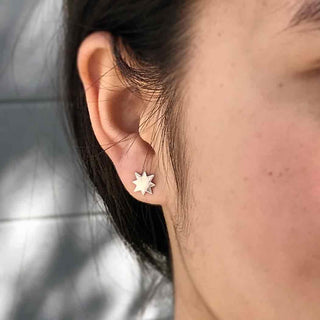 Sterling Silver North Star Earrings on Ear