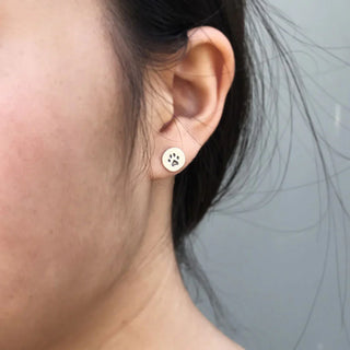 Sterling Silver Etched Paw Print Earrings on Ear