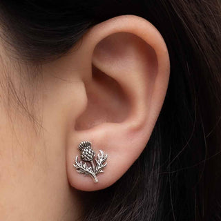 Sterling Silver Thistle Post earrings close up in ear