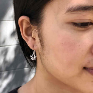 Silver Open Lotus Flower Ear Hooks on Woman's Ear