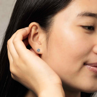 Sterling Silver Pentacle Post Earrings on model ear