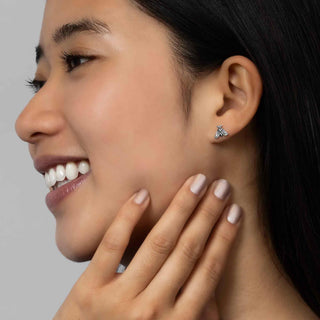 Sterling Silver Moth Post Earrings closeup on model ear