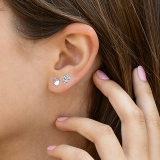 Acorn and oak leaf post earring close up on ear