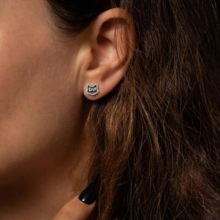 Sterling Silver Black Cat Face Post Earrings closeup on model ear