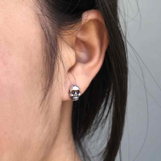 Sterling Silver Skull Earrings on Ear