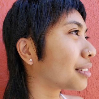 Silver Star Earrings on Ear