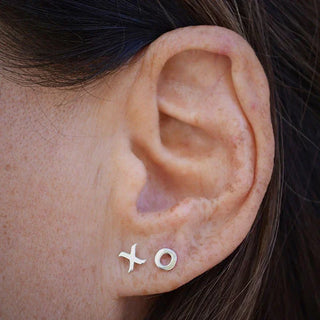 Sterling Silver X & O Earring on Ear