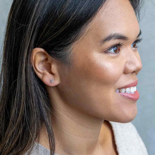 Sterling Silver Mini Snake Post Earrings on ear