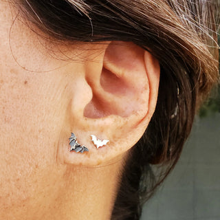 Sterling Silver Flat Tiny Bat Post Earrings on model