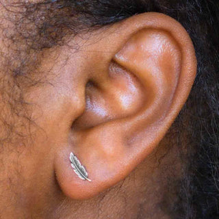 Sterling Silver Feather Post Earrings on model