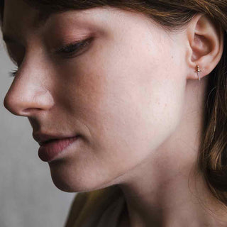 Mini Bronze Sword Post Earrings on Ear Shot