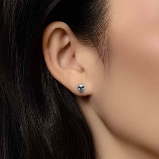 Sterling Silver Mini Skull Earrings on Ear