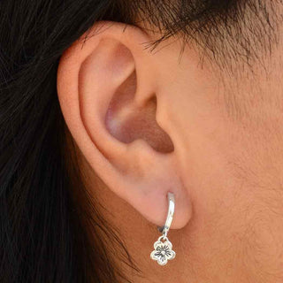 On ear photo of Sterling Silver Huggie Hoop with Cherry Blossom