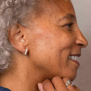 Bronze Diamond Shaped Ear Clicker on Ear