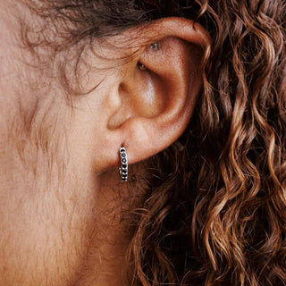 Sterling Silver Huggie Hoop with Black Nanogems on Ear