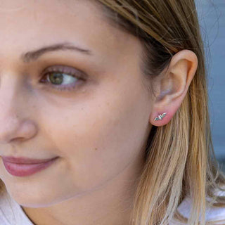 Sterling Silver Tiny Bat Post Earrings on model