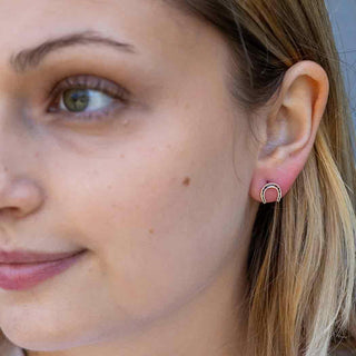 Sterling Silver Horseshoe Post Earrings in ear