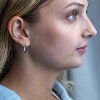 Sterling Silver Oval Huggie Huggies on Ear