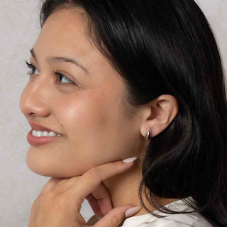 Sterling Silver Ridged Huggie Hoop Earrings on Ear