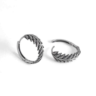 Pair of Fern hoop earrings on white background