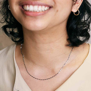 Close up of a woman wearing Rectangle Station Chain