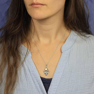 Sterling Silver Mountain and Tree Necklace with Bronze Sun on Woman