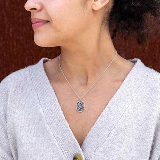 Sterling Silver Raven Necklace on a Woman