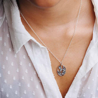 Sterling Silver Flower and Hummingbird Necklace on Neck