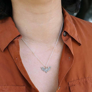 Mixed Metal Star and Moon Bat Necklace on Neck