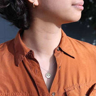 Sterling Silver and Bronze Setting Sun Necklace on Model