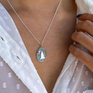 Necklace of a Sterling Silver Pine Tree with Pearl Moon on Woman