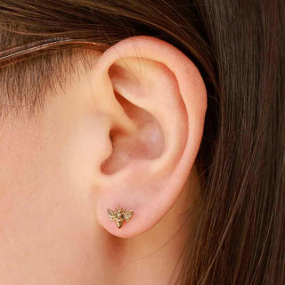 14 karat gold bee earrings on ear