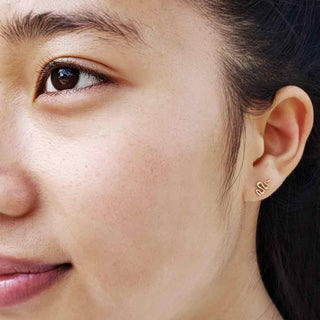 14 karat gold snake earrings on ear