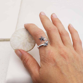 Adjustable Sterling Silver Sea Star and Conch Ring on Hand