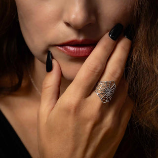 Sterling Silver Spiderweb Ring on model touching her face