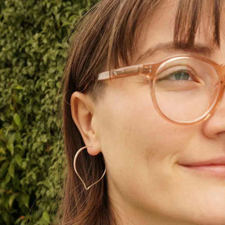 Sterling Silver Lotus Petal Hoop Earrings on Woman