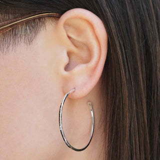 Sterling Silver Hammered 40mm Hoop Earrings on Ear
