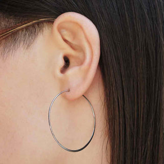 Sterling Silver Half Hammered Circle Hoop Earrings on model