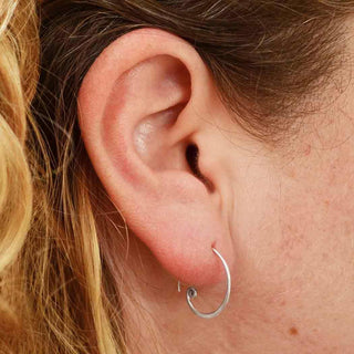 Sterling Silver Hoop Earring with Curlicue on Ear