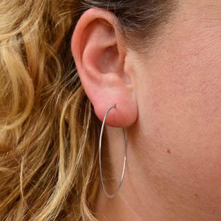 Sterling Silver Half Hammered Hoop Earrings on Ear