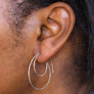 Sterling Silver Wave Hoops on Ear