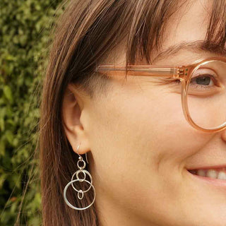 Floating Circle Dangle Earrings on Ear