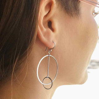 Sterling Silver Floating Circle and Bar Earrings in ear