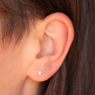 Sterling Silver Tiny Cube Earrings on Ear