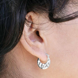 Sterling Silver Hammered Huggie Hoop Earrings on model
