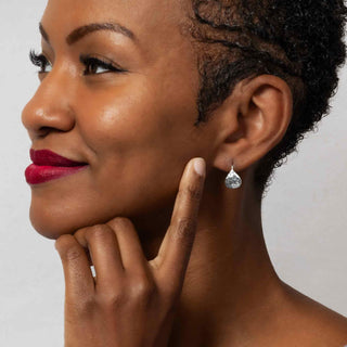 Sterling Silver Hammered Teardrop Earrings on Woman