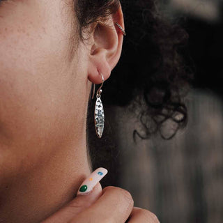 Sterling Silver Hammered Oval Dangle Earrings on model