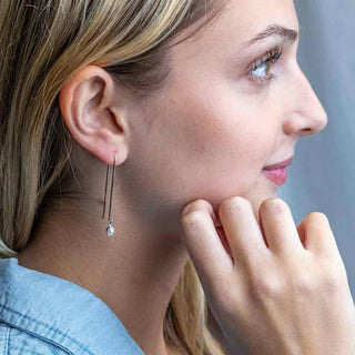 Sterling Silver Long Arch Earrings with Pearl Drop on model